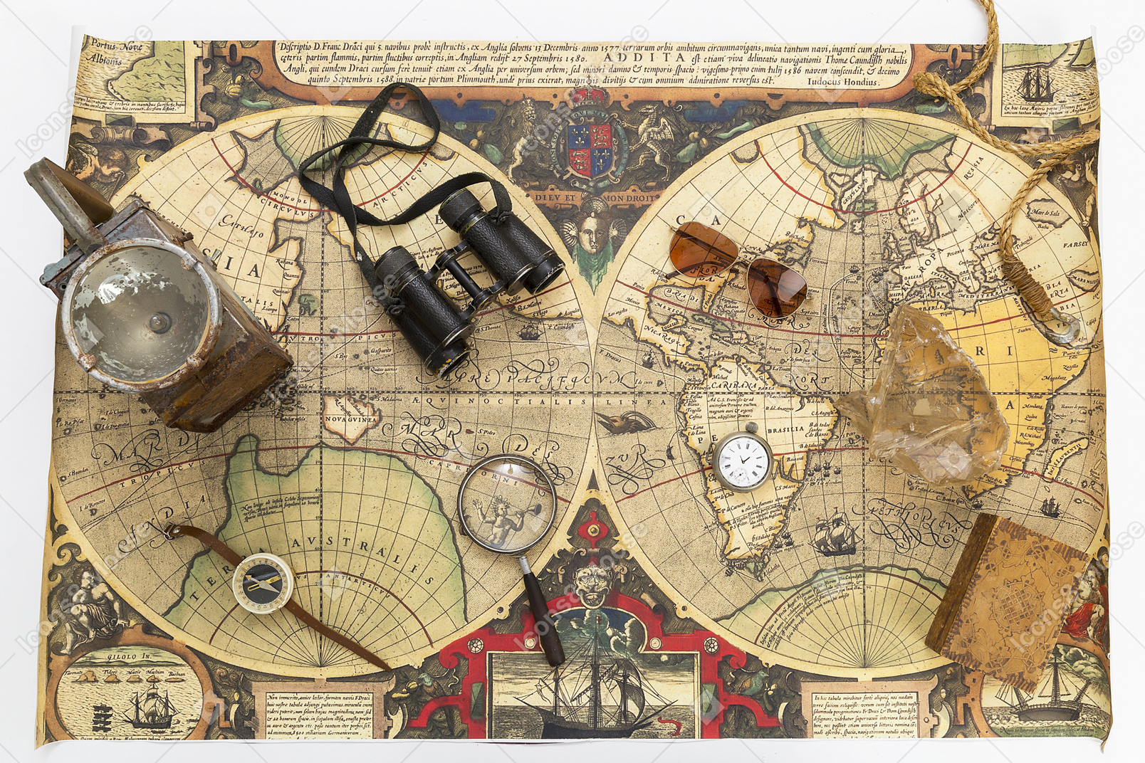 Compass, vintage box, binoculars, magnifying glass on map