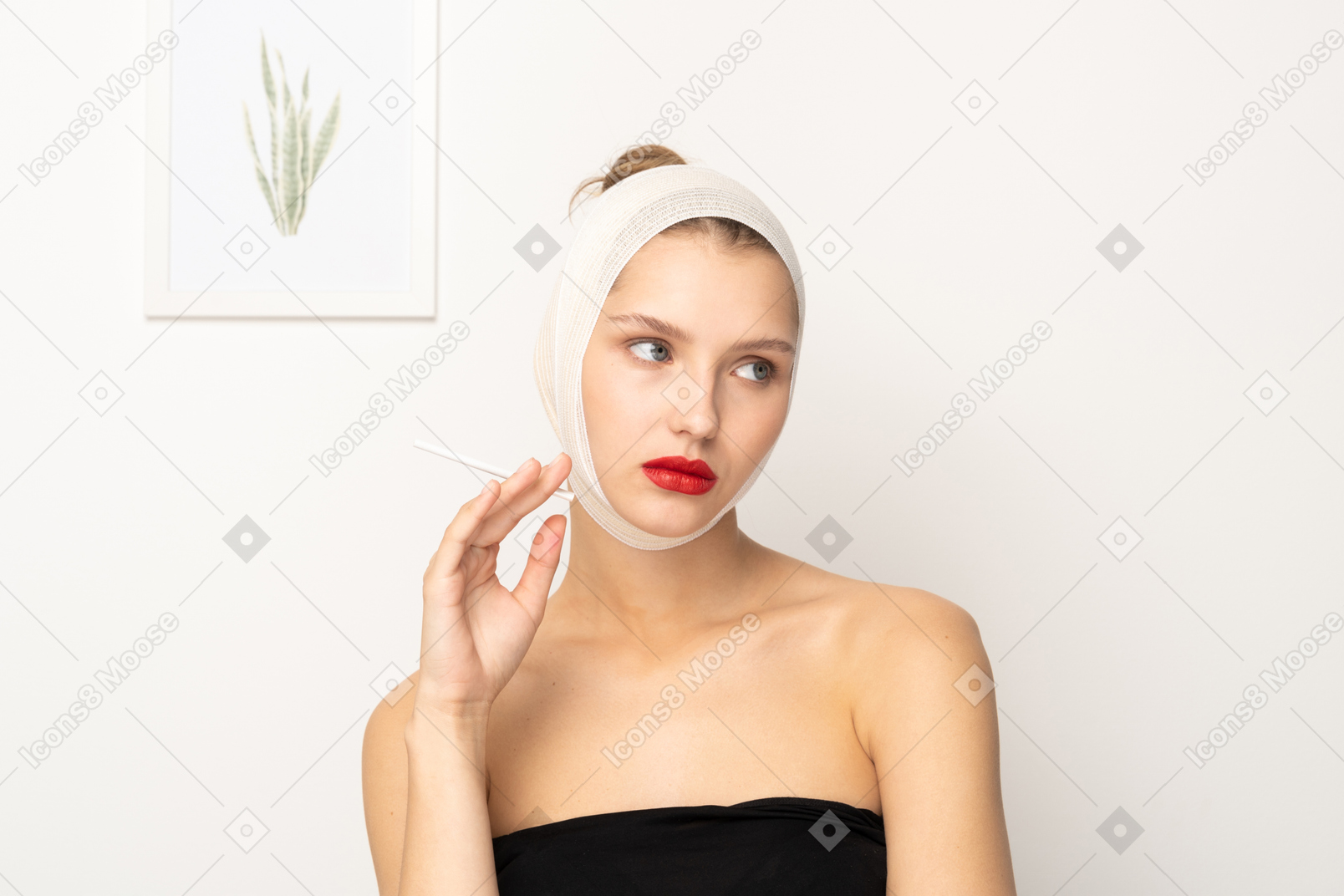 Woman with bandaged head raising one hand