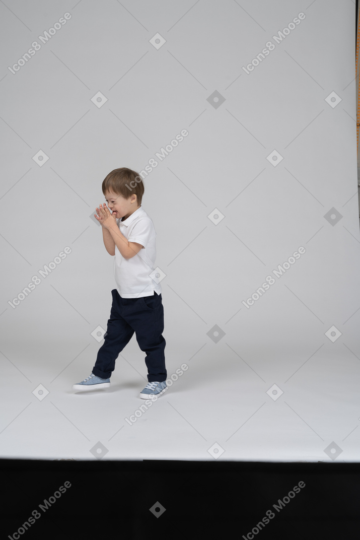Laughing little boy in casual clothes