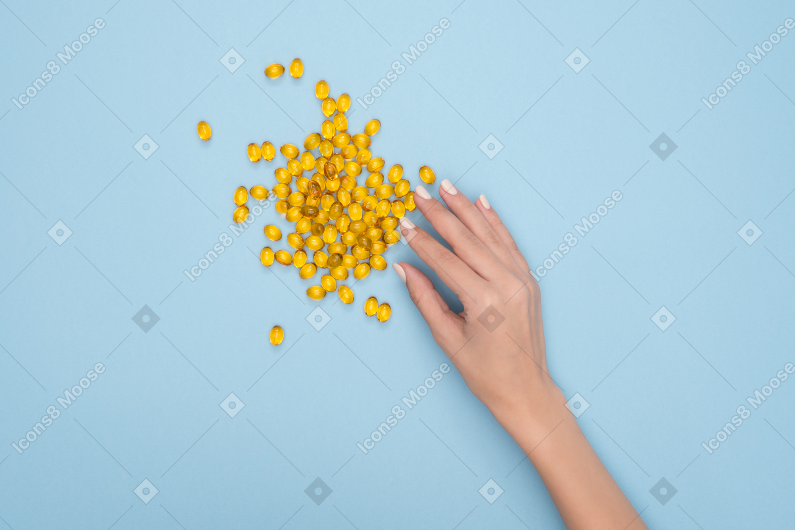 Female hand taking fish oil pill