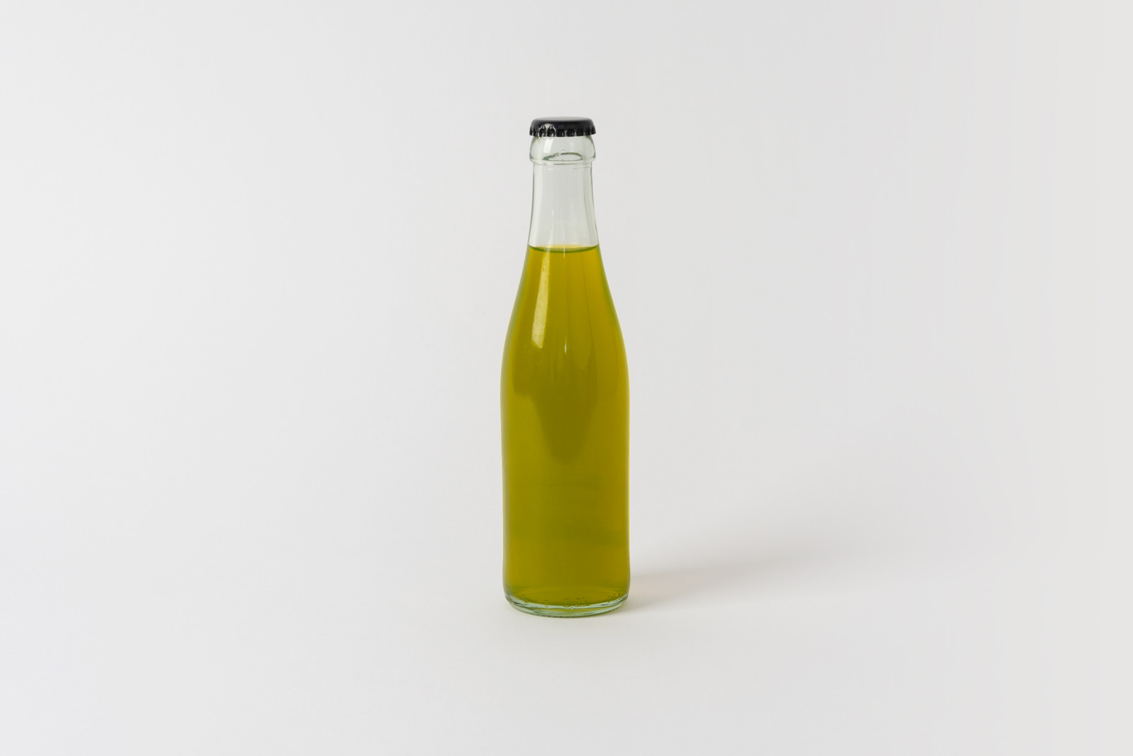 Glass bottle with some soft drink