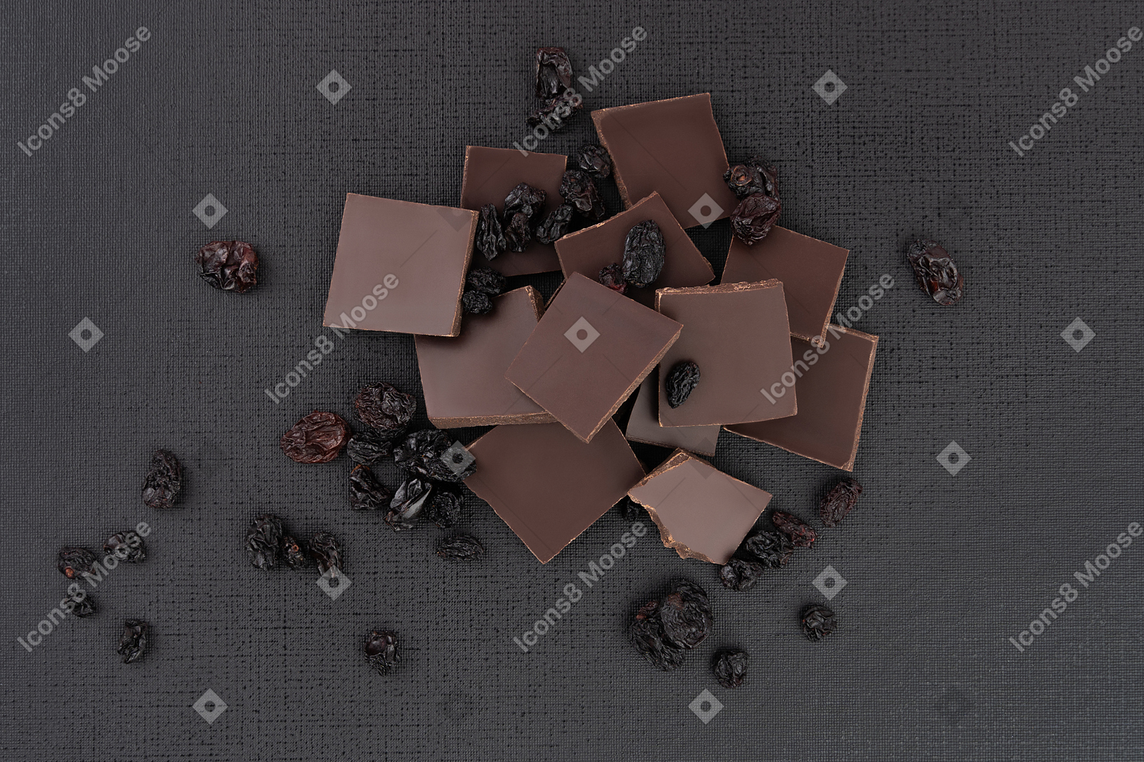 Crashed chocolate with raisins on the black