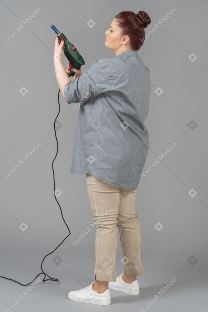 Young woman double checking her screw driver