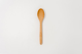 Wooden spoon on white background