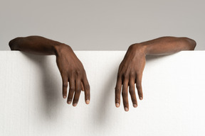 Human hands on styrofoam board