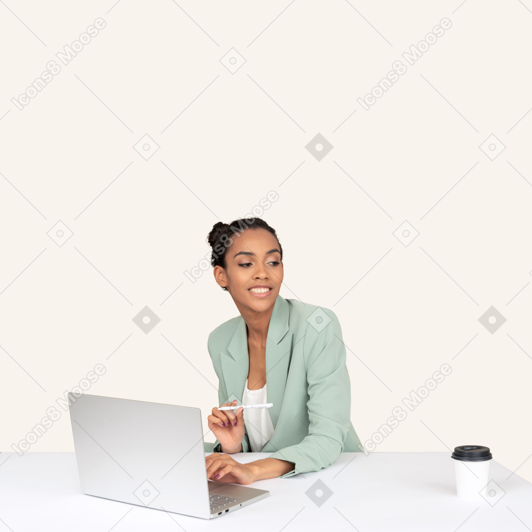 A man sitting in front of a laptop