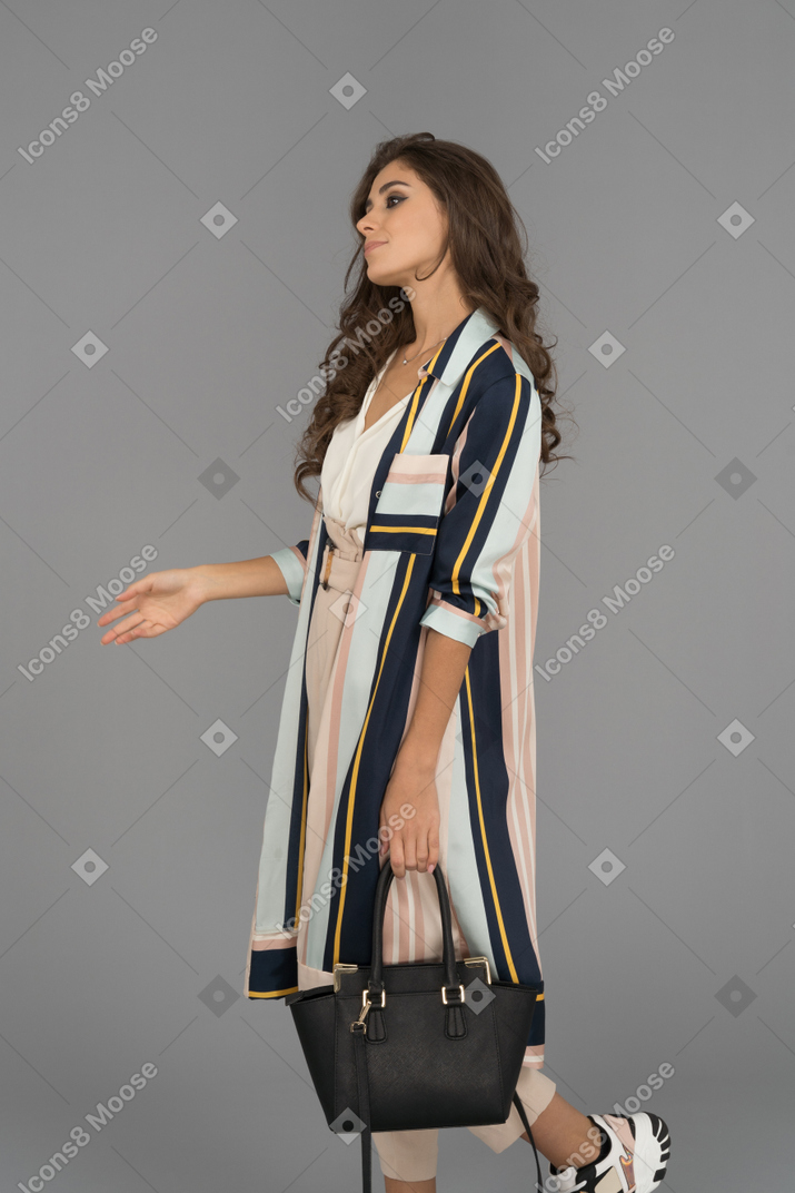 Disappointed young woman looking aside and gesturing