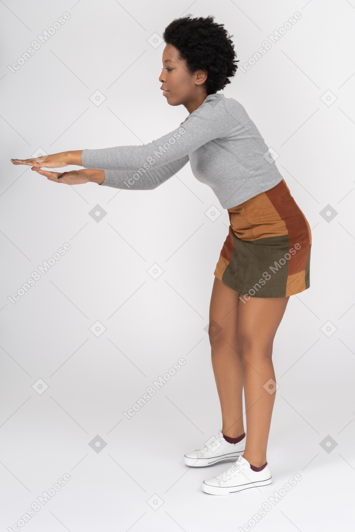 African girl moving her hands in a dance