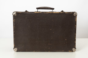 Old suitcase on a white background