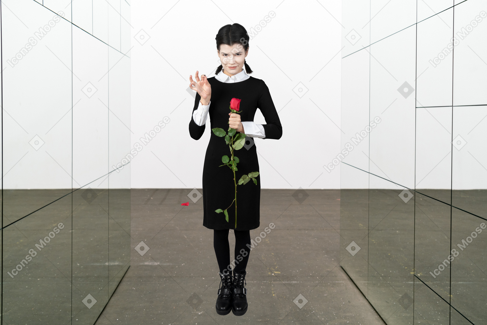 A woman in a black dress holding a rose