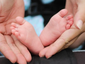 Small feet of a newborn