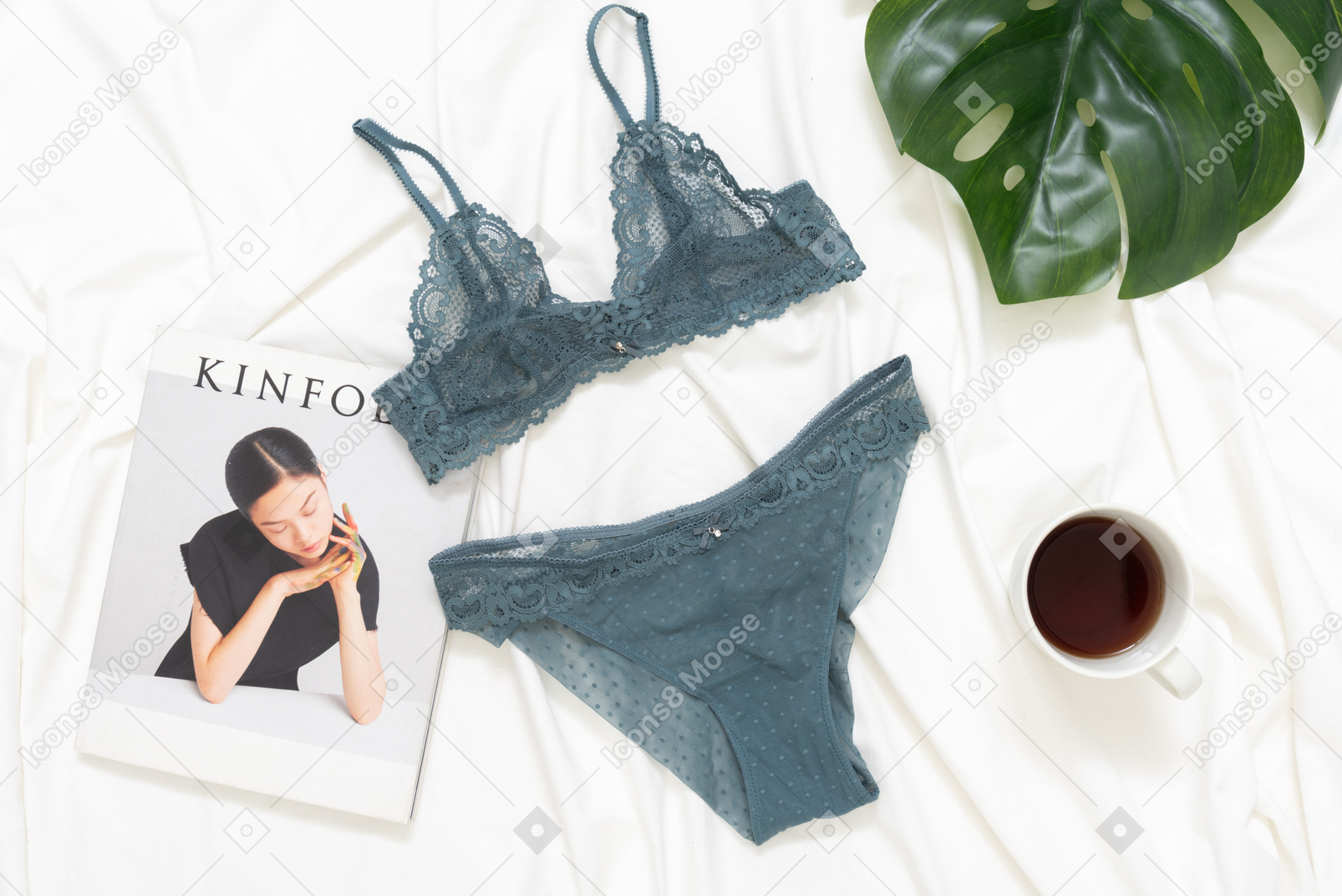 Lace lingerie, magazine and cup of coffee