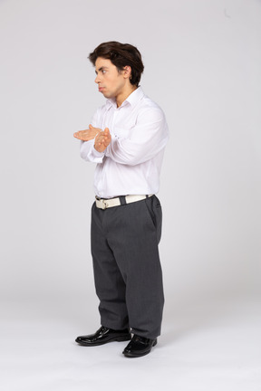 Young man showing stop gesture with crossed hands