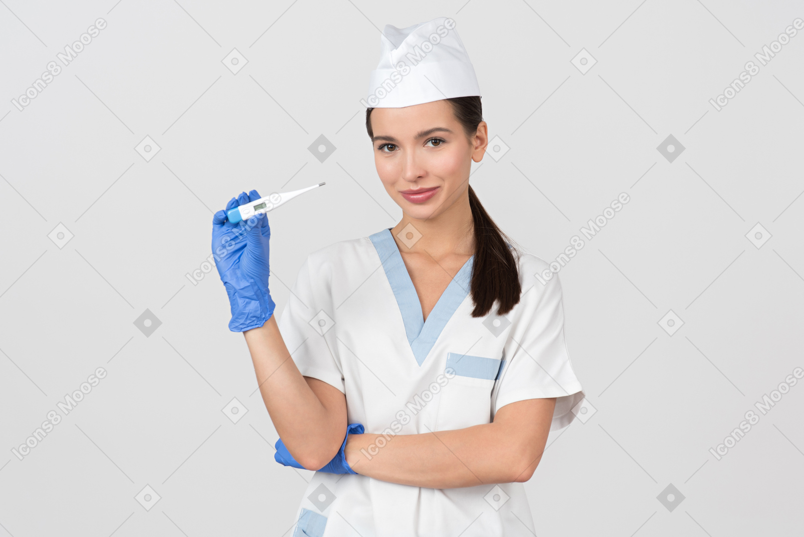 Attractive nurse showing a digital thermometer