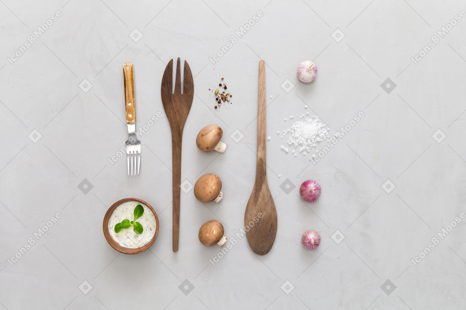 Champignons, garlic, spices and wooden spoons