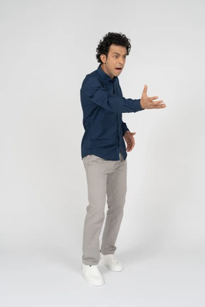 Side view of a man in casual clothes gesturing