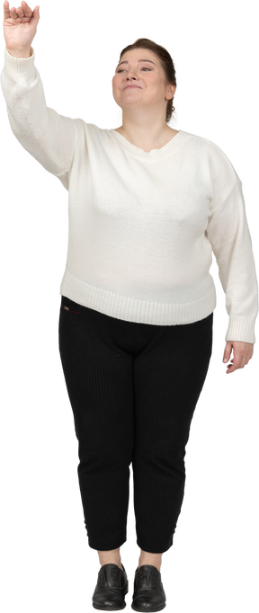 Front view of a plus size woman in casual clothes greeting someone