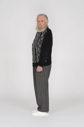 Side view of old man looking over shoulder