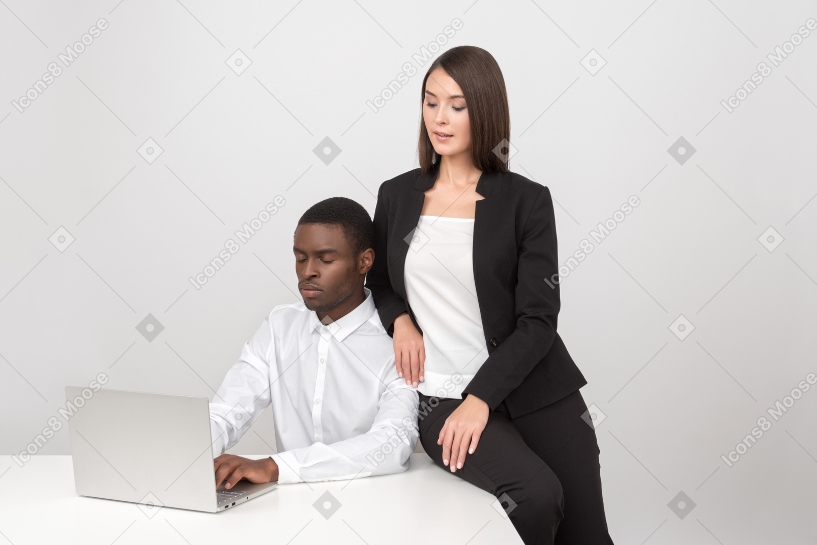 Attractive asian woman flirting with her colleague in the workplace