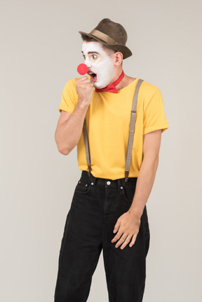 Male clown gasping