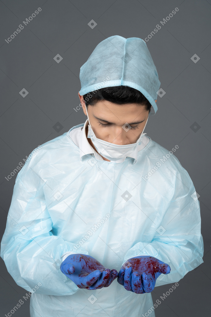 Doctor with bloody hands