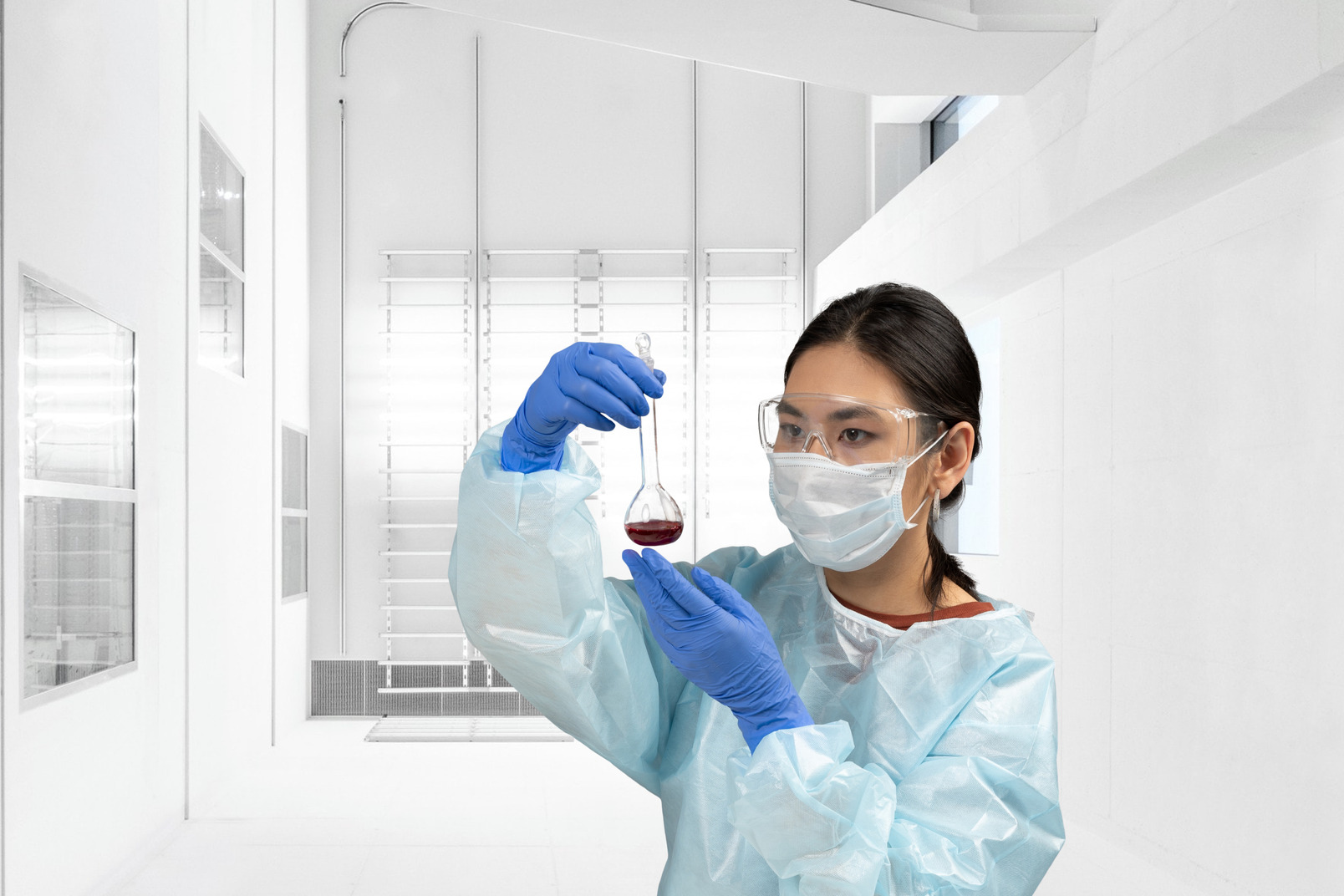Portrait of a female scientist in a clean room