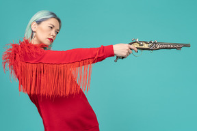 Woman aiming a handgun