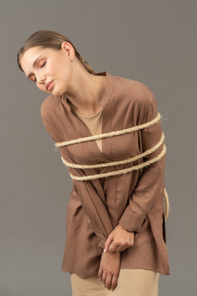 Closed eyes woman tied up
