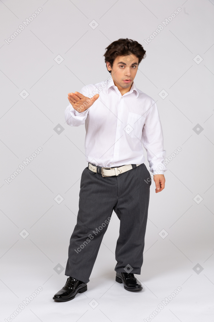Young man showing stop gesture with hand