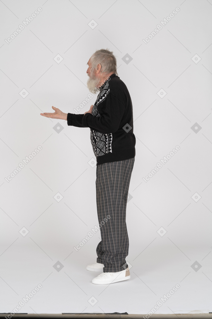 Elderly man outstretching his arm