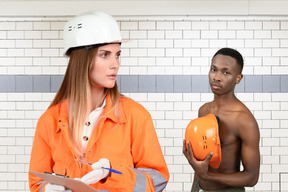 A man and a woman in a construction worker uniform