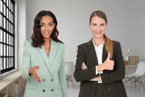 Female colleagues welcoming new one in the office