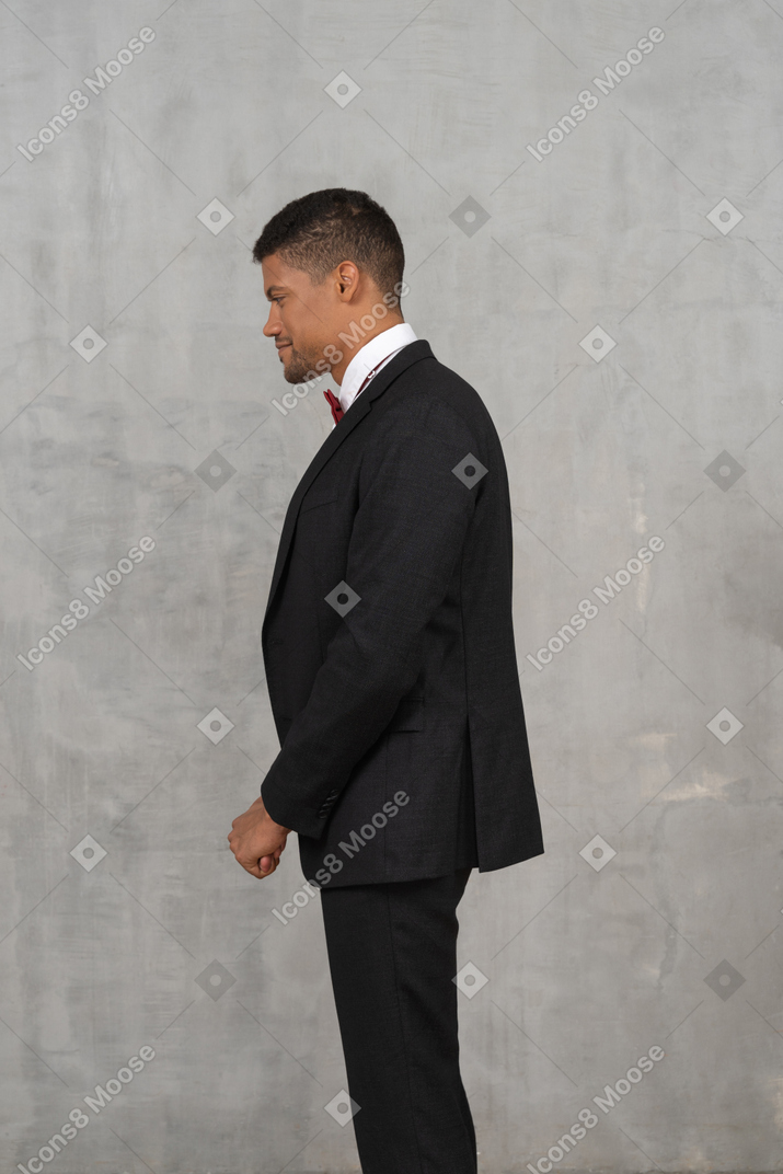 Man in black suit standing