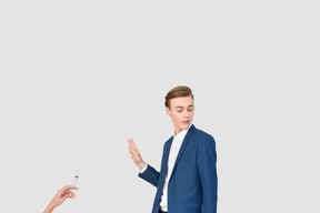 A man in a blue suit refusing vaccination
