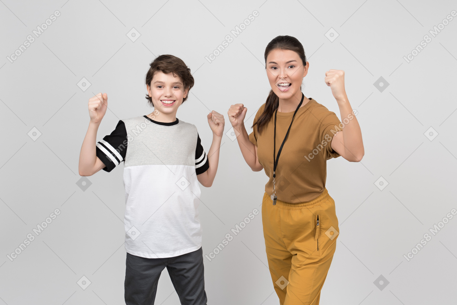 Pe teacher and pupil clenching their fists and feeling powerful