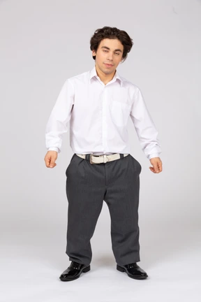 Young man in white shirt blinking