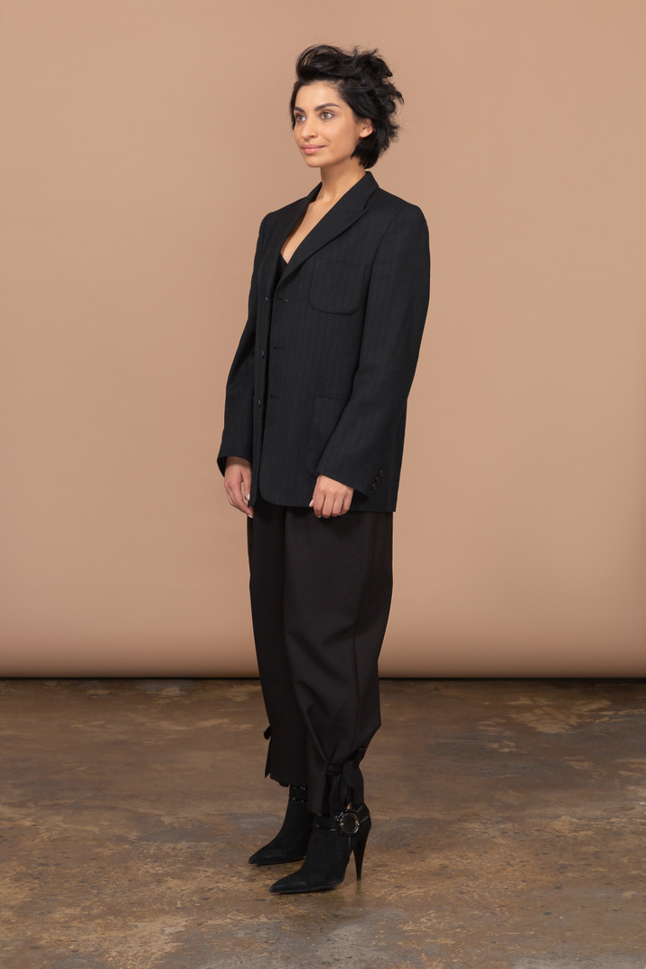 Three-quarter view of a businesswoman wearing black suit