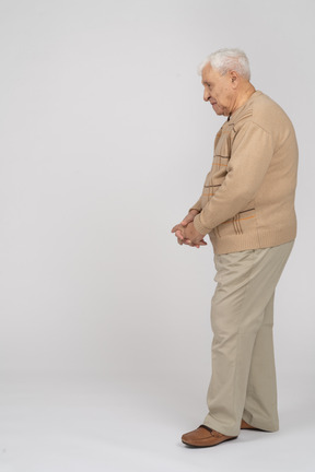 Side view of an old man in casual clothes