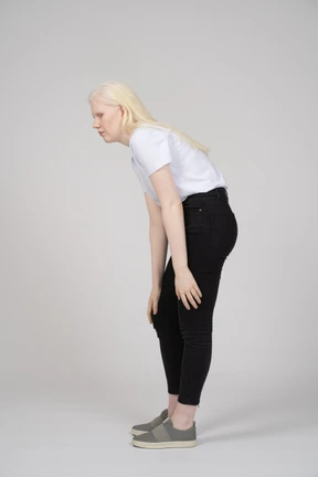Young woman in casual clothes touching her knee
