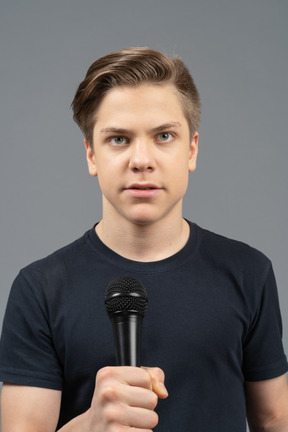 Young man holding microphone