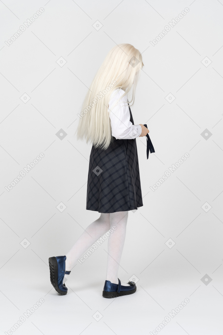 Schoolgirl tying her belt