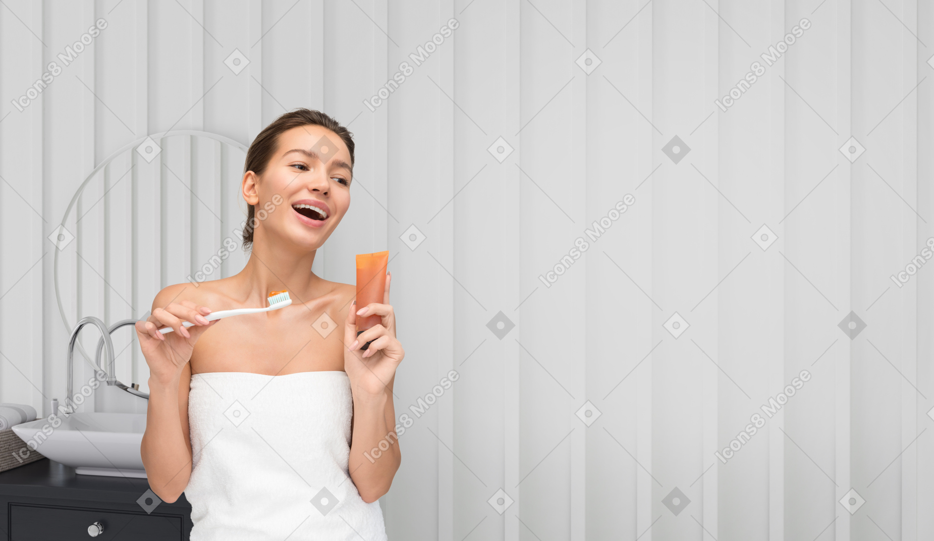 Young beautiful woman about to clean her teeth