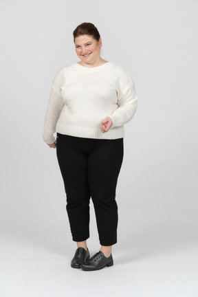 Happy plus size woman in casual clothes smiling