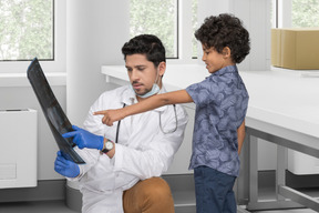 Doctor and his little patient watching an x-ray