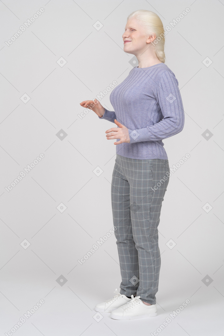 Woman standing and gesturing