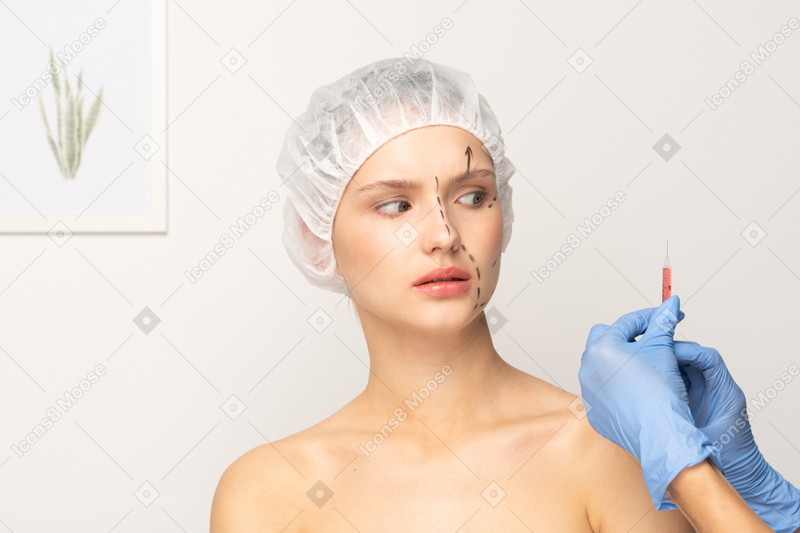Young woman looking panicked before filler injection