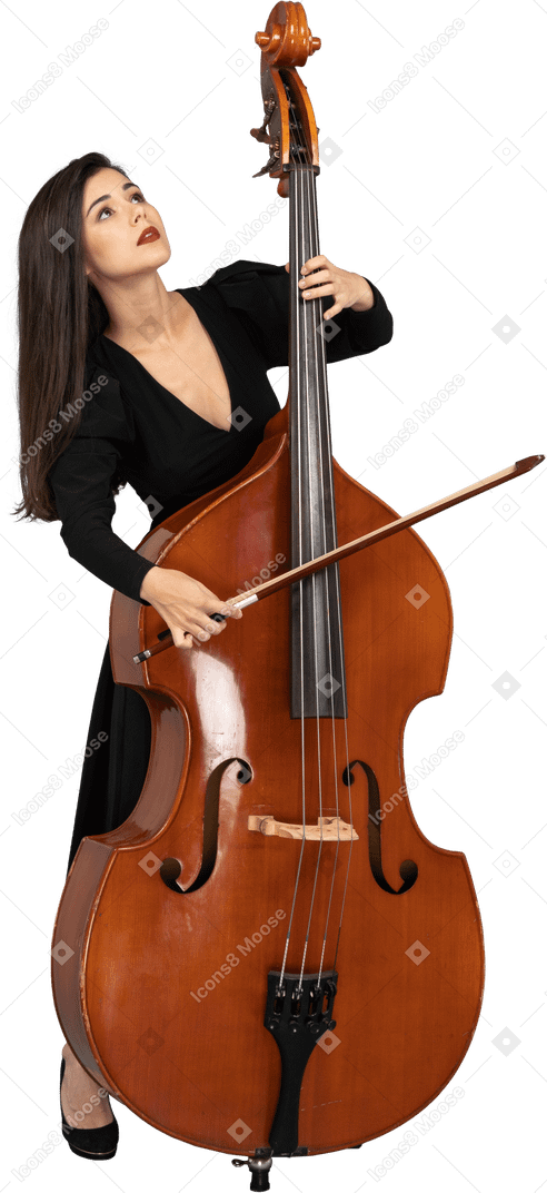 Front view of a young woman in black dress playing the double-bass with a bow while looking up