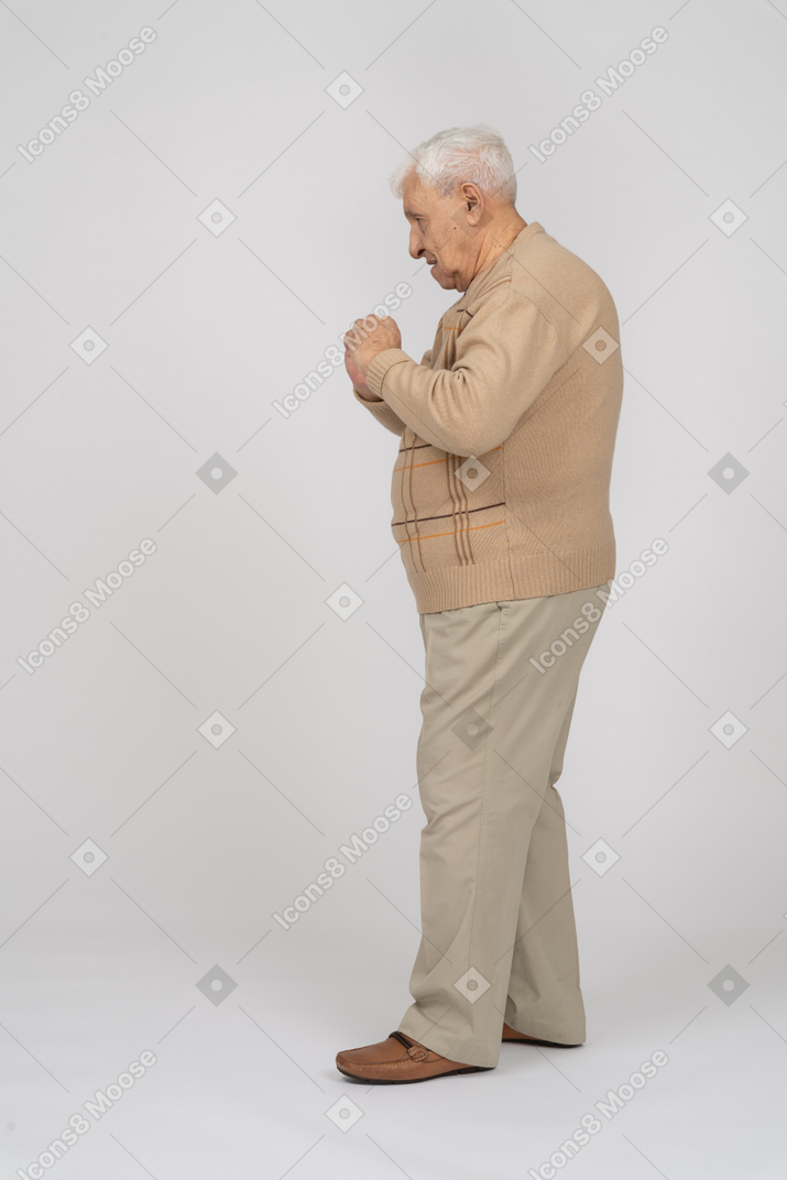 Side view of a thoughtful old man in casual clothes