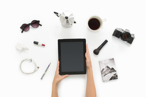 Female hands holding ipad