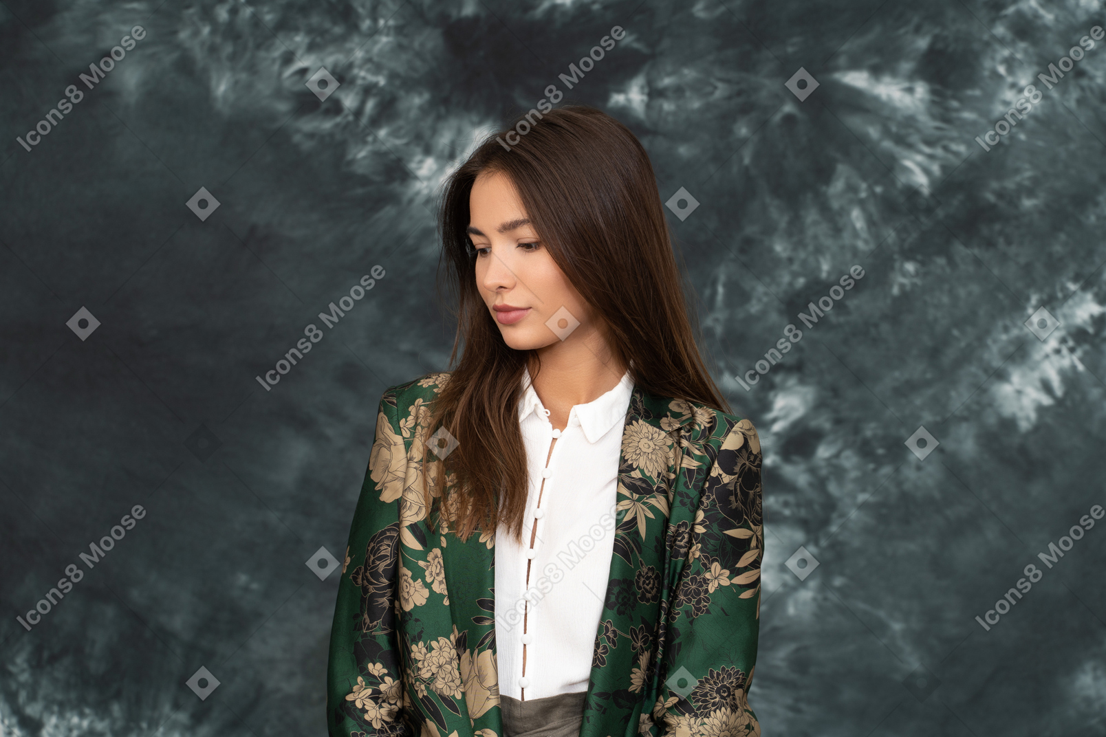 Close-up of a woman in silk japanese jacket looking down